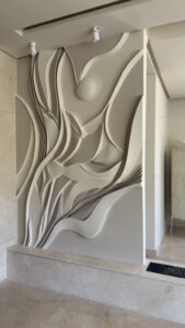 Custom abstract 3D basalt wall relief with artistic painted finish by MarbleVeins in Jordan.