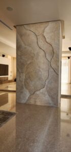 Organic 3D basalt stone wall relief with artistic painted finish by MarbleVeins in Jordan.
